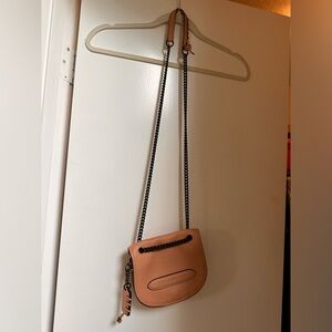 Coach tan purse with chain detail.